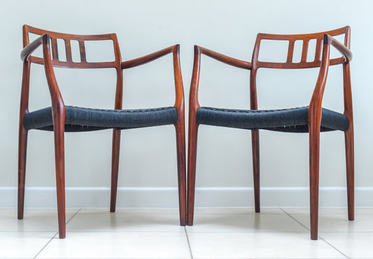 A scarce pair of Niels Otto Møller Model 64 Rosewood Carver Chairs for J L Moller, Denmark.