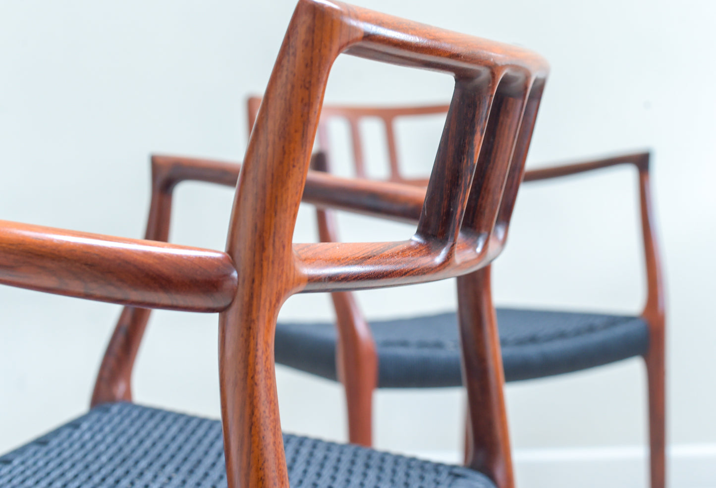 A scarce pair of Niels Otto Møller Model 64 Rosewood Carver Chairs for J L Moller, Denmark.