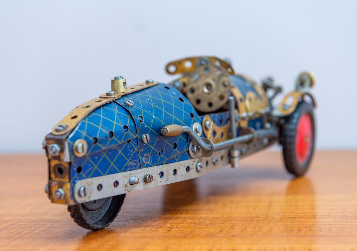 A Fine Scratch Built Meccano 3 Wheel Racing Car In Red Blue And Gold. Made In England. Circa 1940