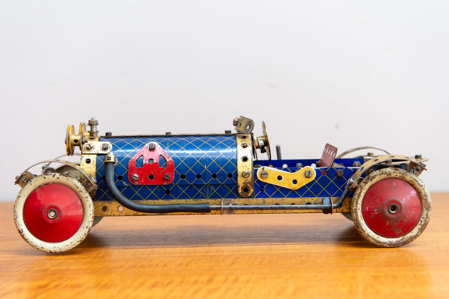 A Fine Scratch Built Meccano Racing Car In Red Blue And Gold. Made In England. Circa 1940