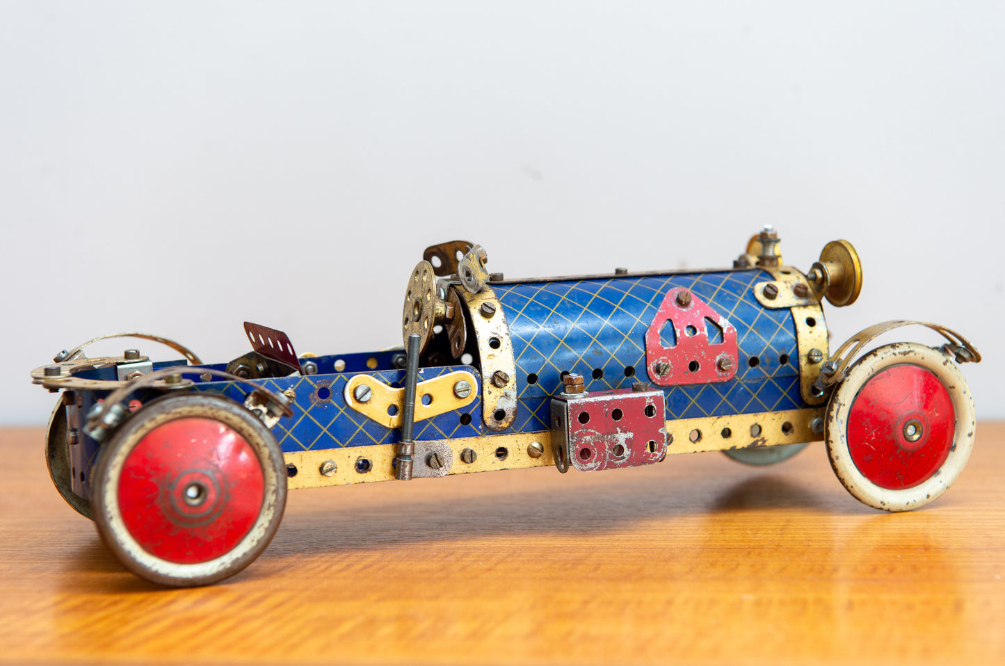 A Fine Scratch Built Meccano Racing Car In Red Blue And Gold. Made In England. Circa 1940