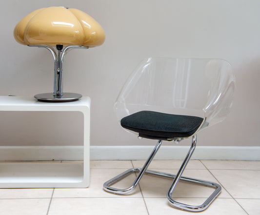 Guzzini Armchair in metal and acrylic by Harvey GUZZINI from 1968. Legs in chromed metal. Shell in acrylic. Seat in black upholstery. In good vintage condition. This is the smaller version ‘ART 6004’ Rarely available. 
